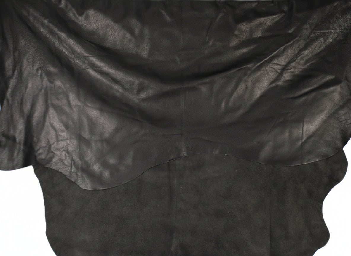 Black leather cowhide with a pebble surface on a white background